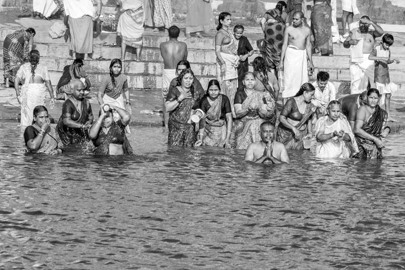 Challenges Impacting the Connection between Water and Religion - Devotees taking holy bath at a Ghat on the banks of river Ganga in Varanasi, Uttar Pradesh